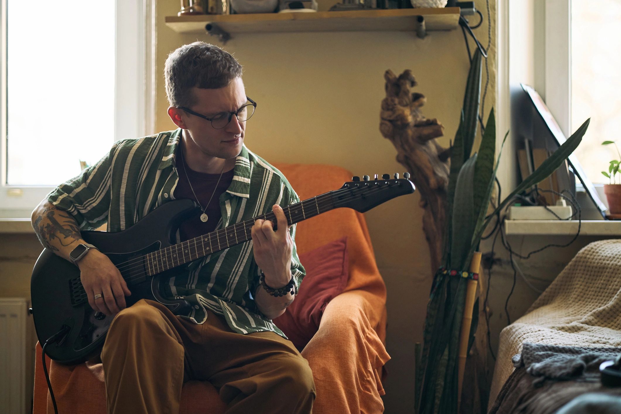 Independent guitarist practicing and developing music ideas