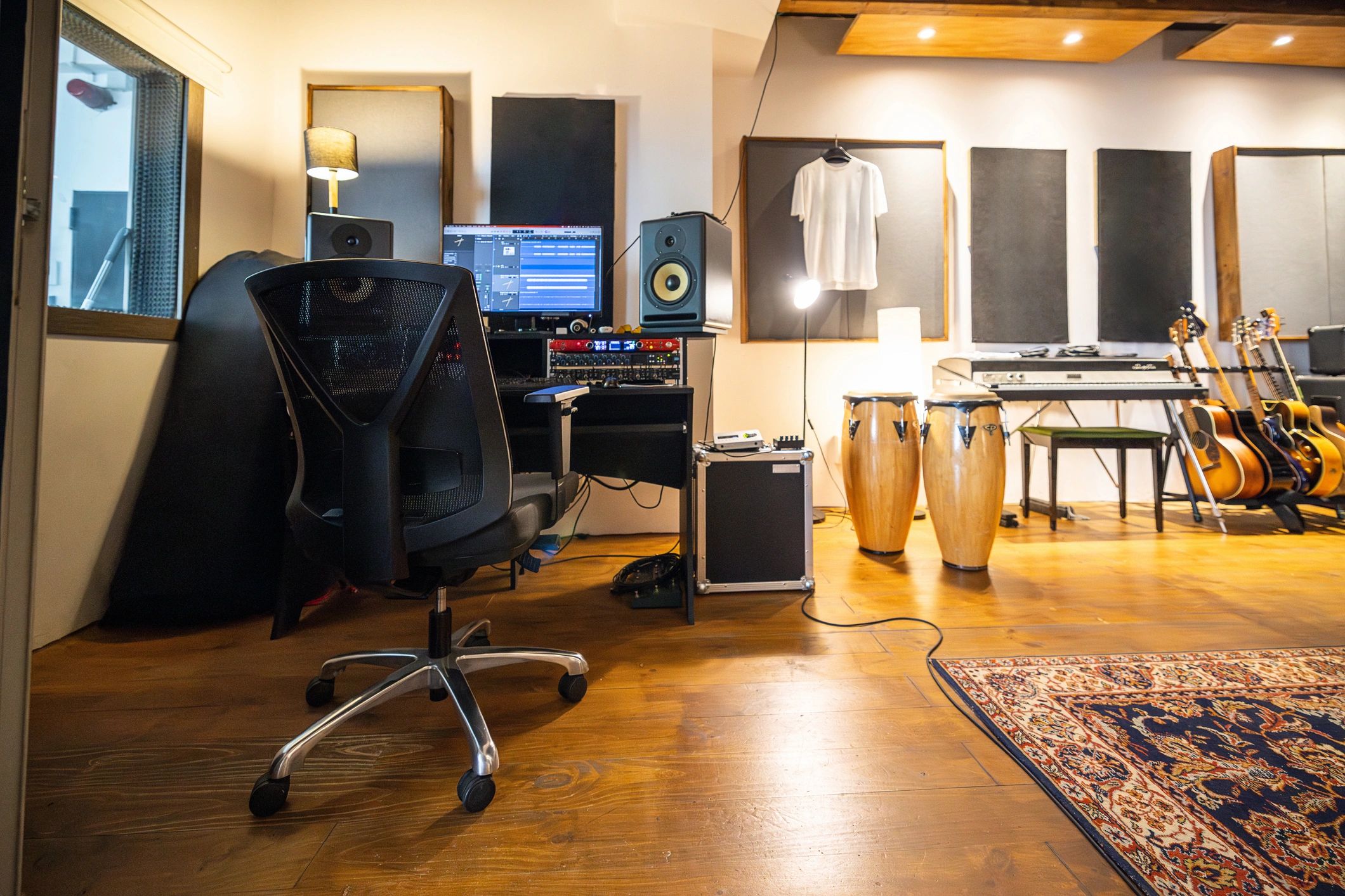 Music production studio with drums and amplifiers