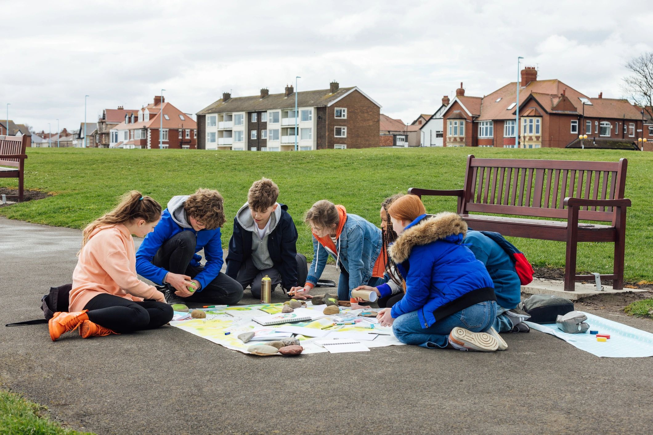 Teen group collaborating in a creative workshop
