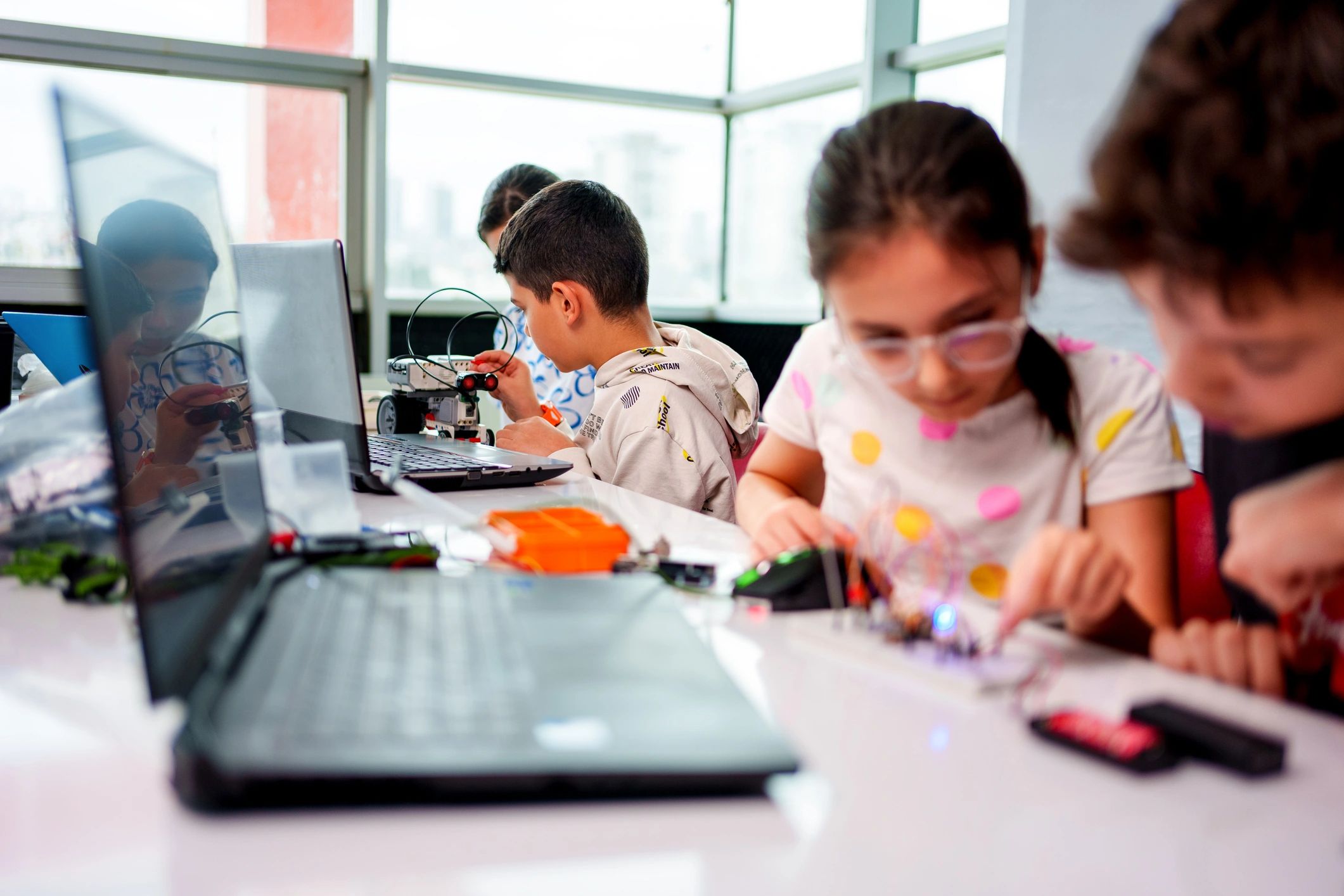 Students participating in a hands-on robotics and STEM workshop